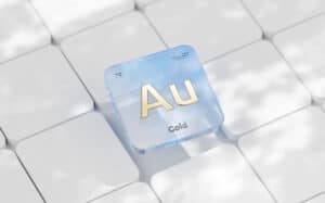 3D rendering of the gold (Au) element symbol on a keyboard, representing gold nanoparticle ink in printed electronics.